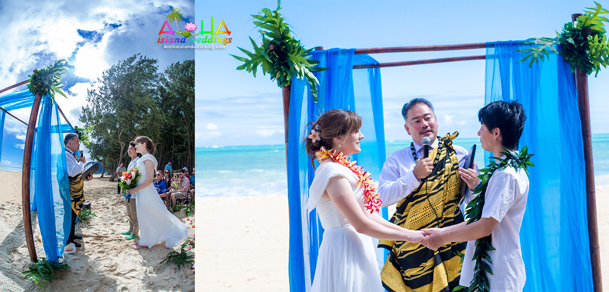 Pastor John performing a ceremony under a blue draped arch on the beach
